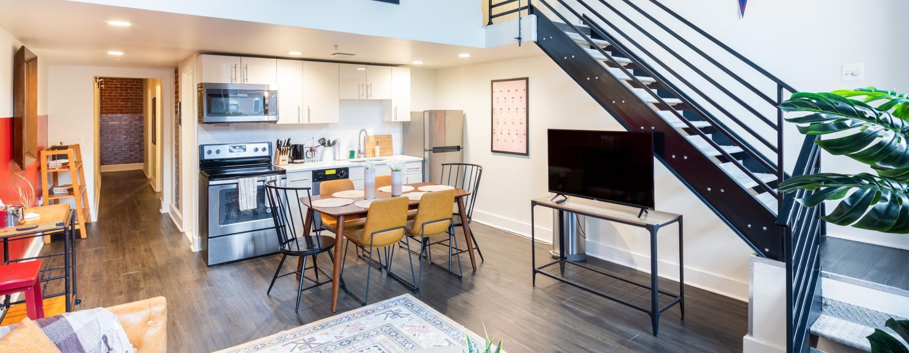 a living room with a staircase