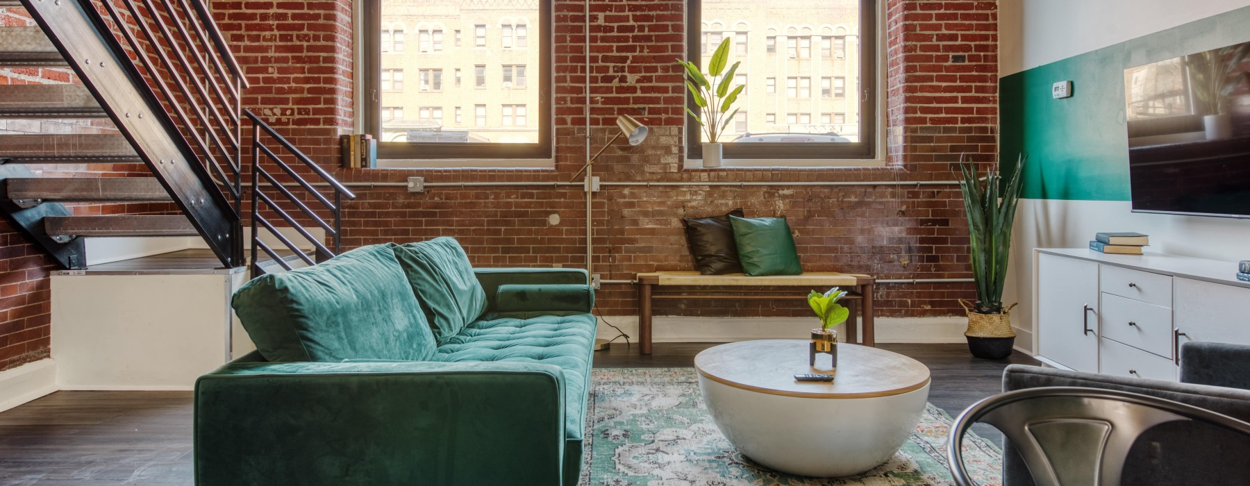 a living room with a couch and a table