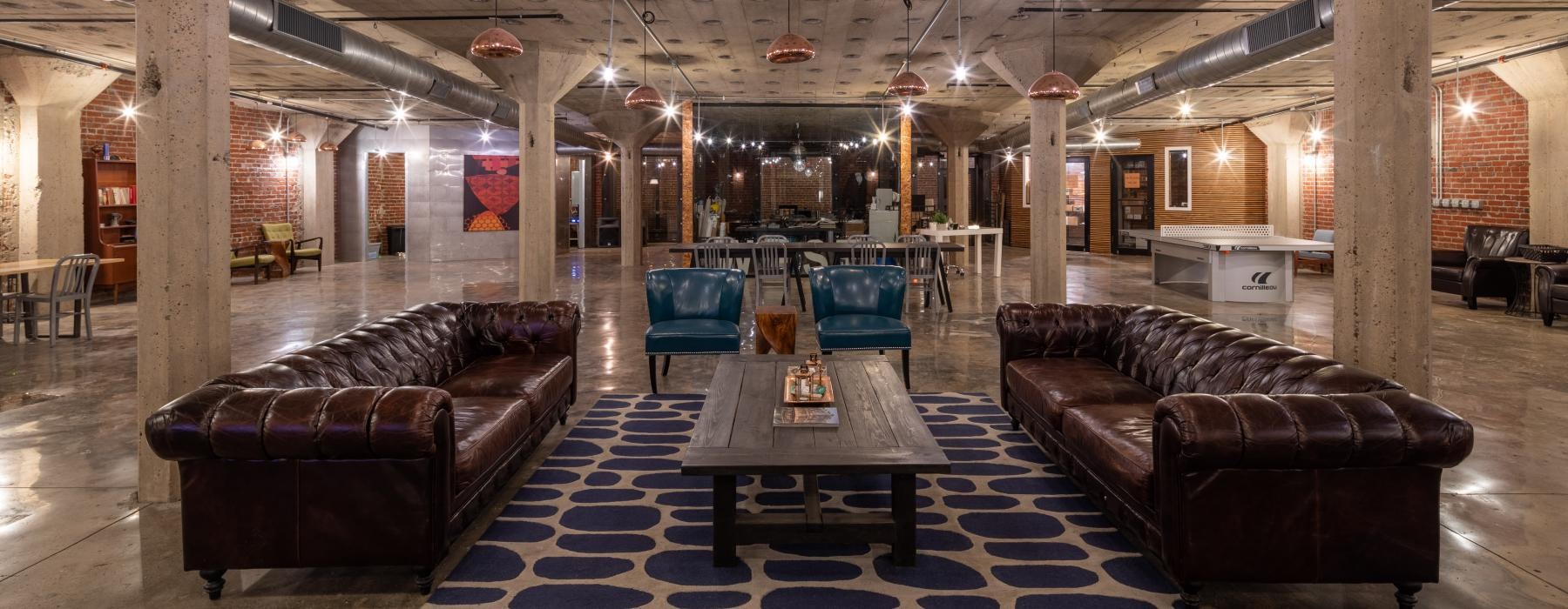 a large room with couches and tables