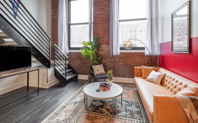 a living room with a couch and a table